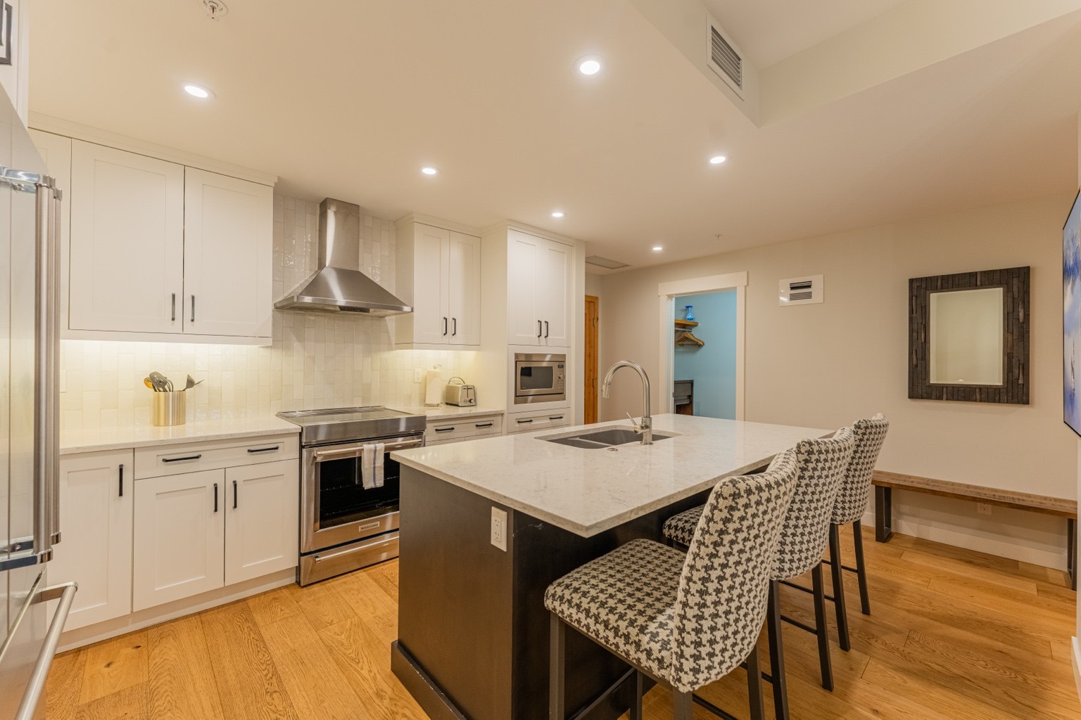 Fully equipped white and wood luxury kitchen